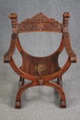 A 19th century carved walnut Savonarola chair. H.85 W.62cm.
