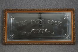 An etched glass pub mirror in gilt frame. H.64 W.120cm.