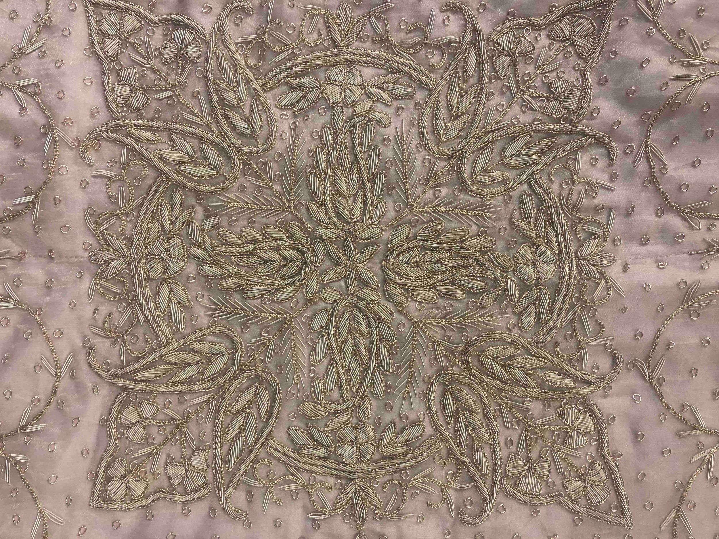 An Indian embroidered cotton bedspread. Decorated with with a intricate floral pattern L.262 W. - Image 5 of 7