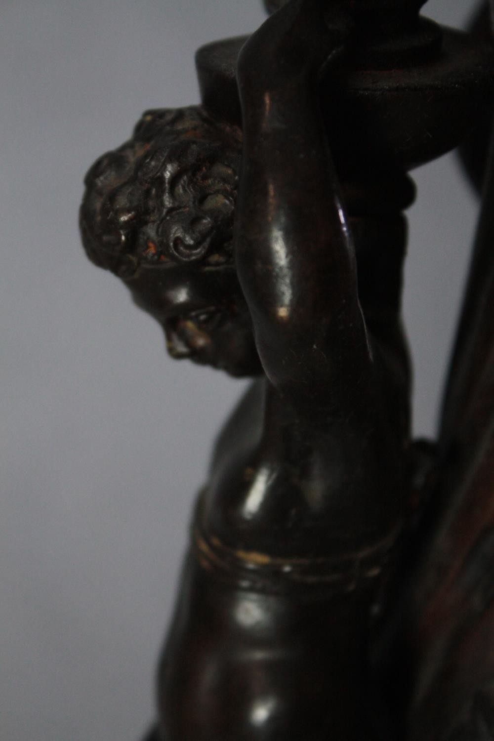 A large bronze 19th century Classical style figural torchere decorated with putti holding the - Image 8 of 11