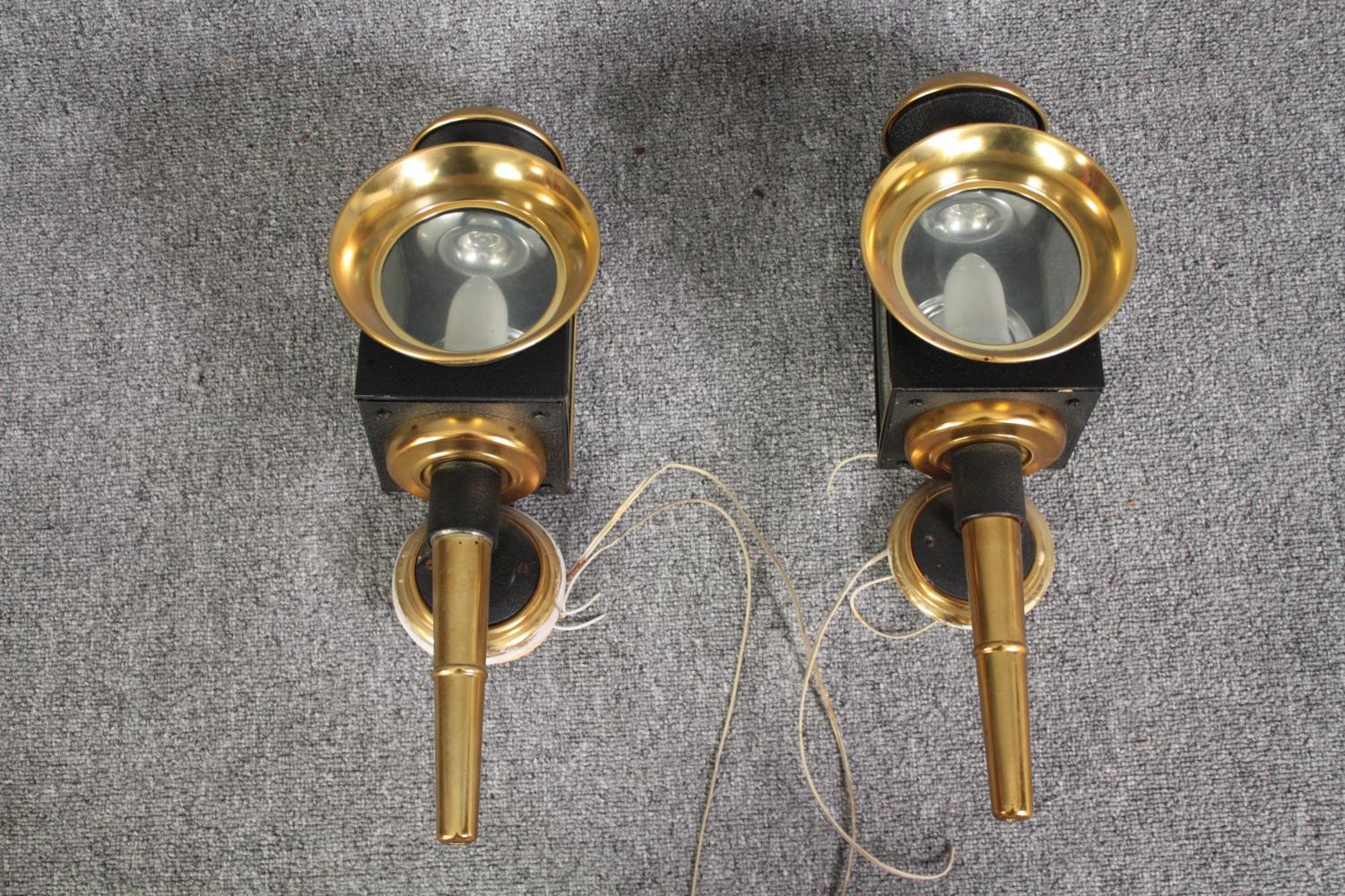 Two modern brass wall lights. Modelled on the style of coaching lamps. H.49cm. (each)