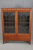 Bookcase, mid century oak with leaded and coloured glass doors. H.137 W.107 D.24cm.