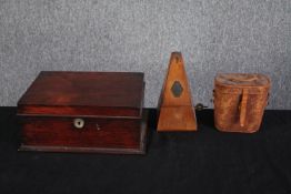 A boxed metronome, a pair of binoculars and a 19th century mahogany box. The metronome is complete
