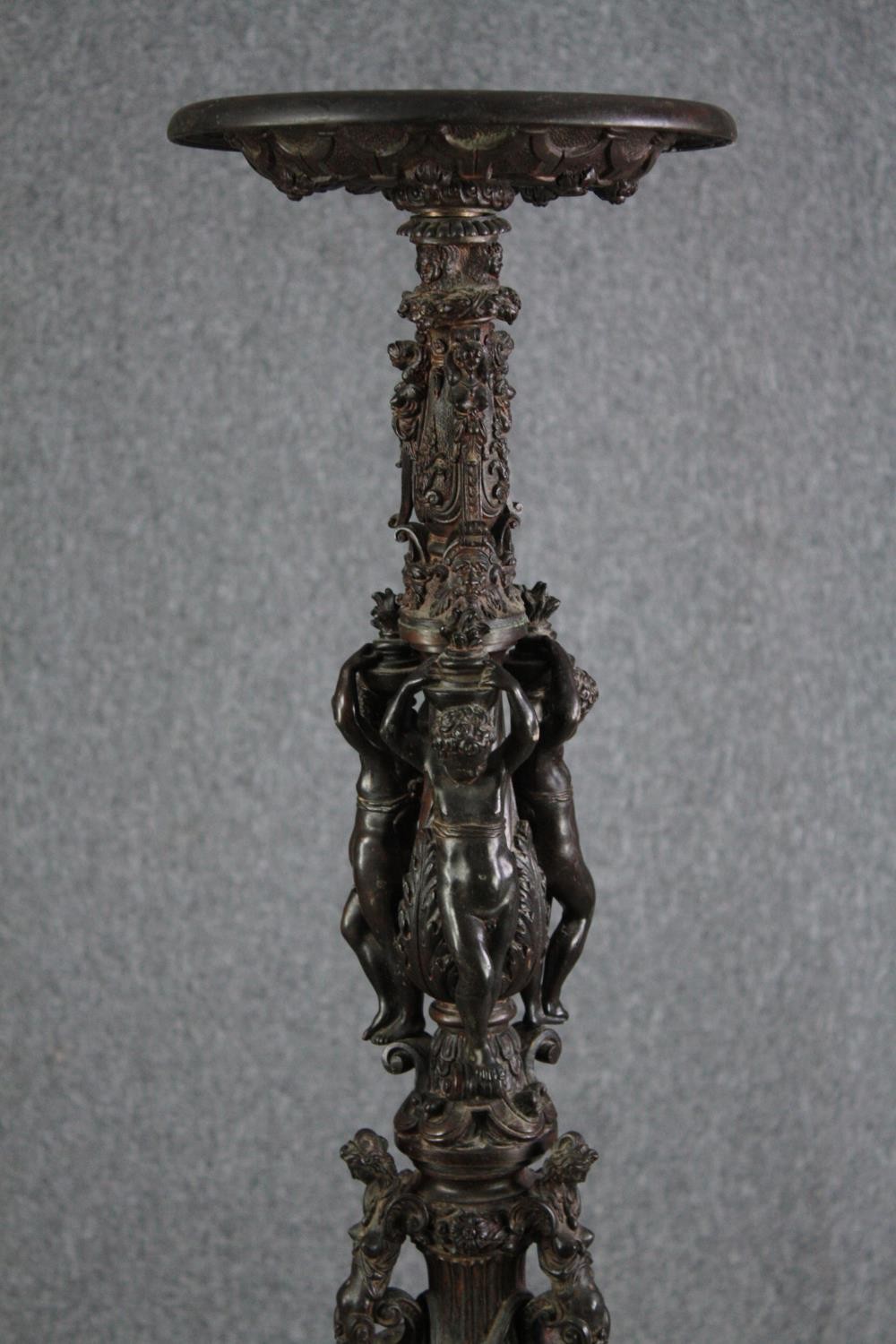 A large bronze 19th century Classical style figural torchere decorated with putti holding the - Image 2 of 11
