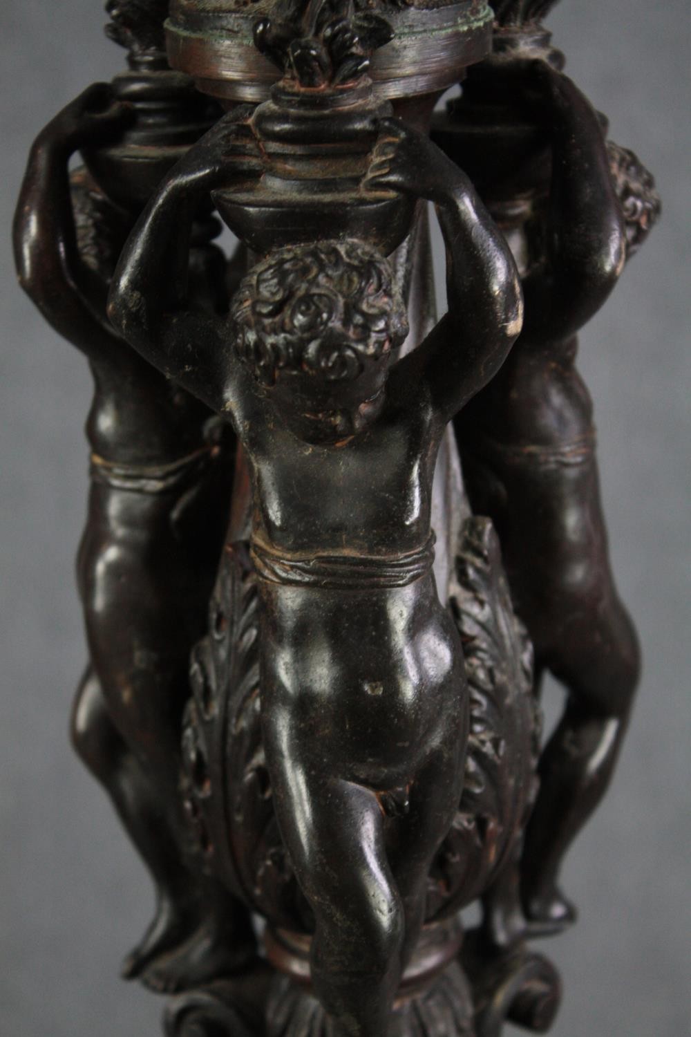 A large bronze 19th century Classical style figural torchere decorated with putti holding the - Image 5 of 11