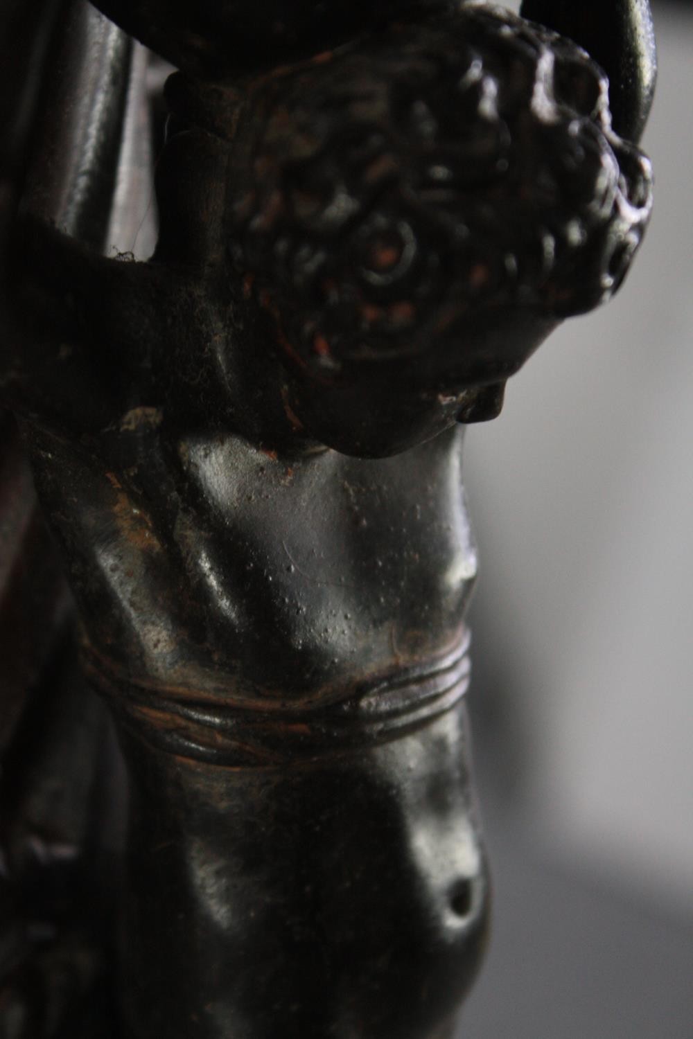 A large bronze 19th century Classical style figural torchere decorated with putti holding the - Image 9 of 11