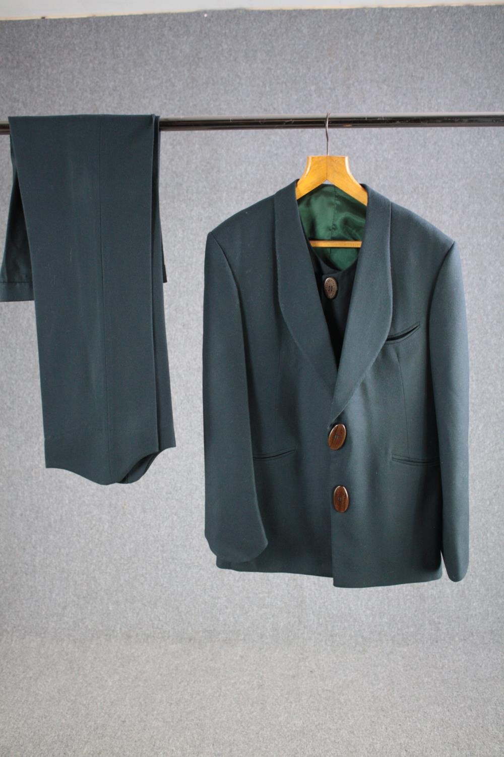 A vintage bespoke made teal silk mix three piece suit with maker's label and silk lining.