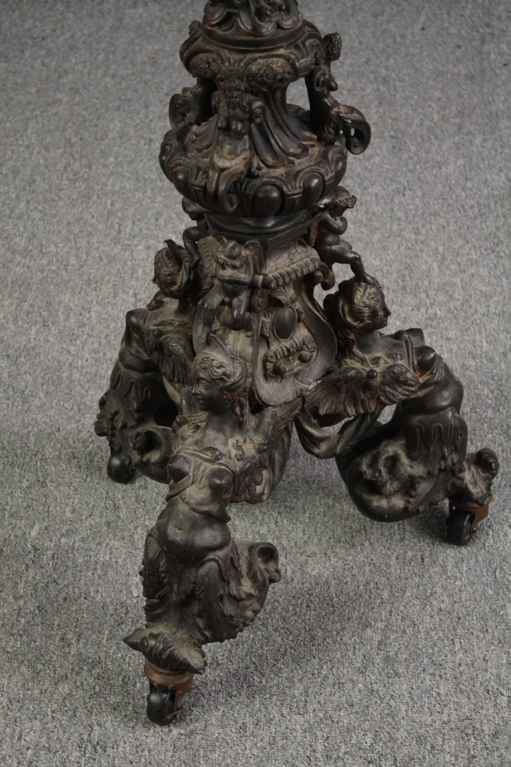 A large bronze 19th century Classical style figural torchere decorated with putti holding the - Image 3 of 11