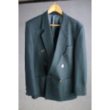 A vintage bespoke made teal silk mix jacket with mother of pearl buttons and maker's label.