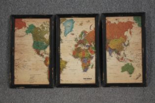 A map of the world framed in three parts. Post war. Framed and glazed. H.60 W.35 cm.