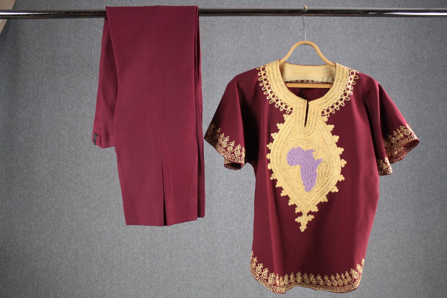 A bespoke vintage African inspired maroon velvet top with outline of Africa embellished and