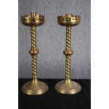 A pair of Gothic style brass candle holders with twist stems. H.40cm. (each)