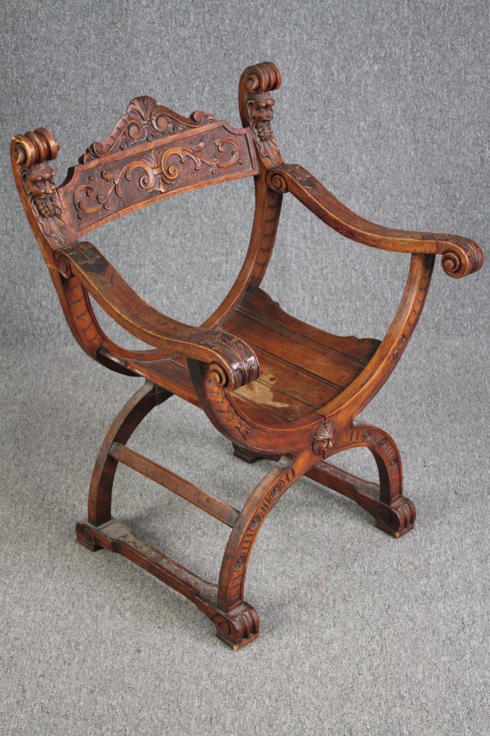 A 19th century carved walnut Savonarola chair. H.85 W.62cm. - Image 2 of 6