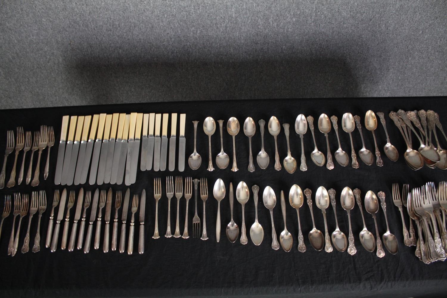 An extensive mixed collection of steel and silver plated cutlery. The steel cutlery is made by