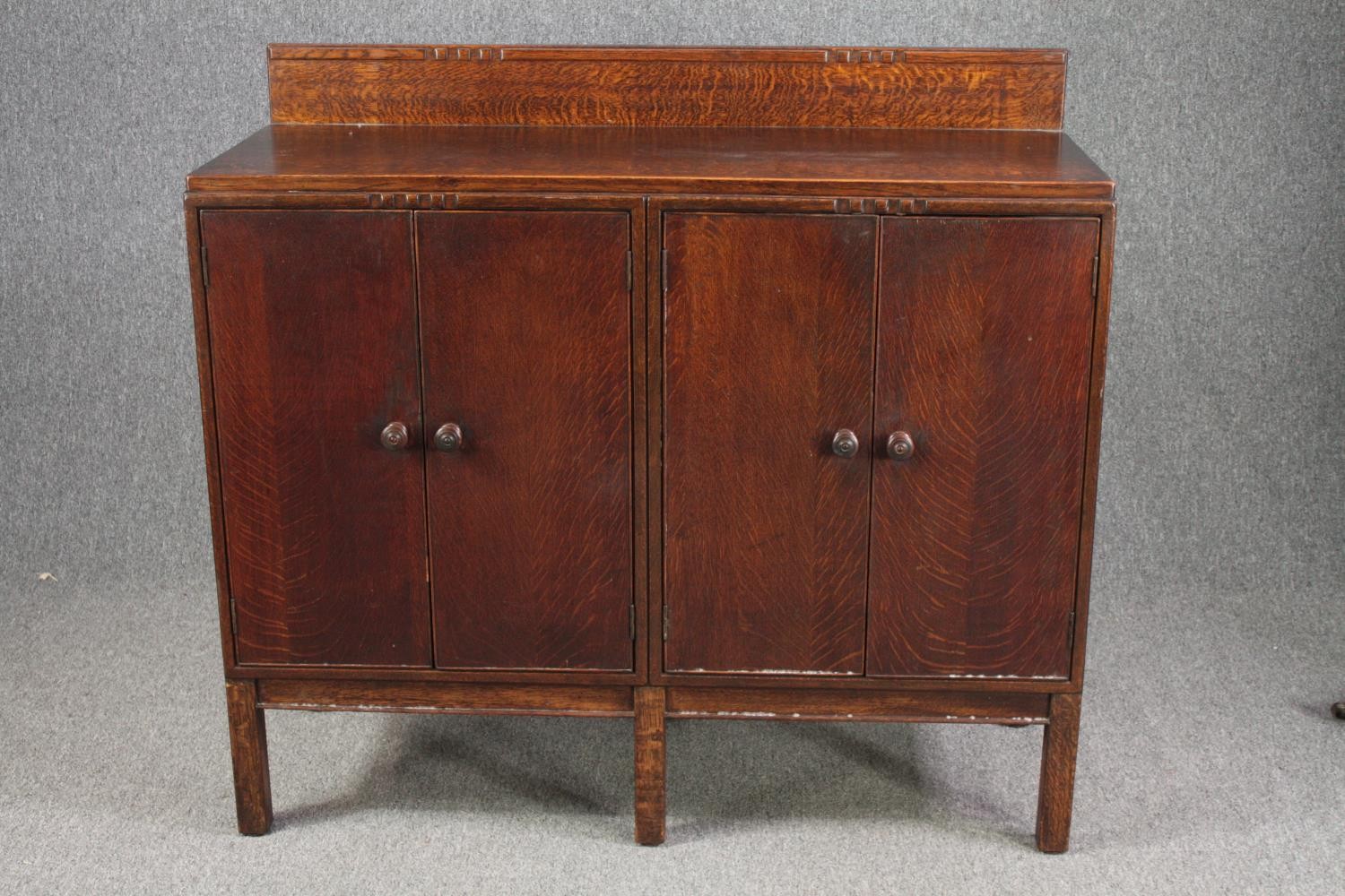 Dwarf sideboard, mid century oak. H.110 W.121 D.48cm.