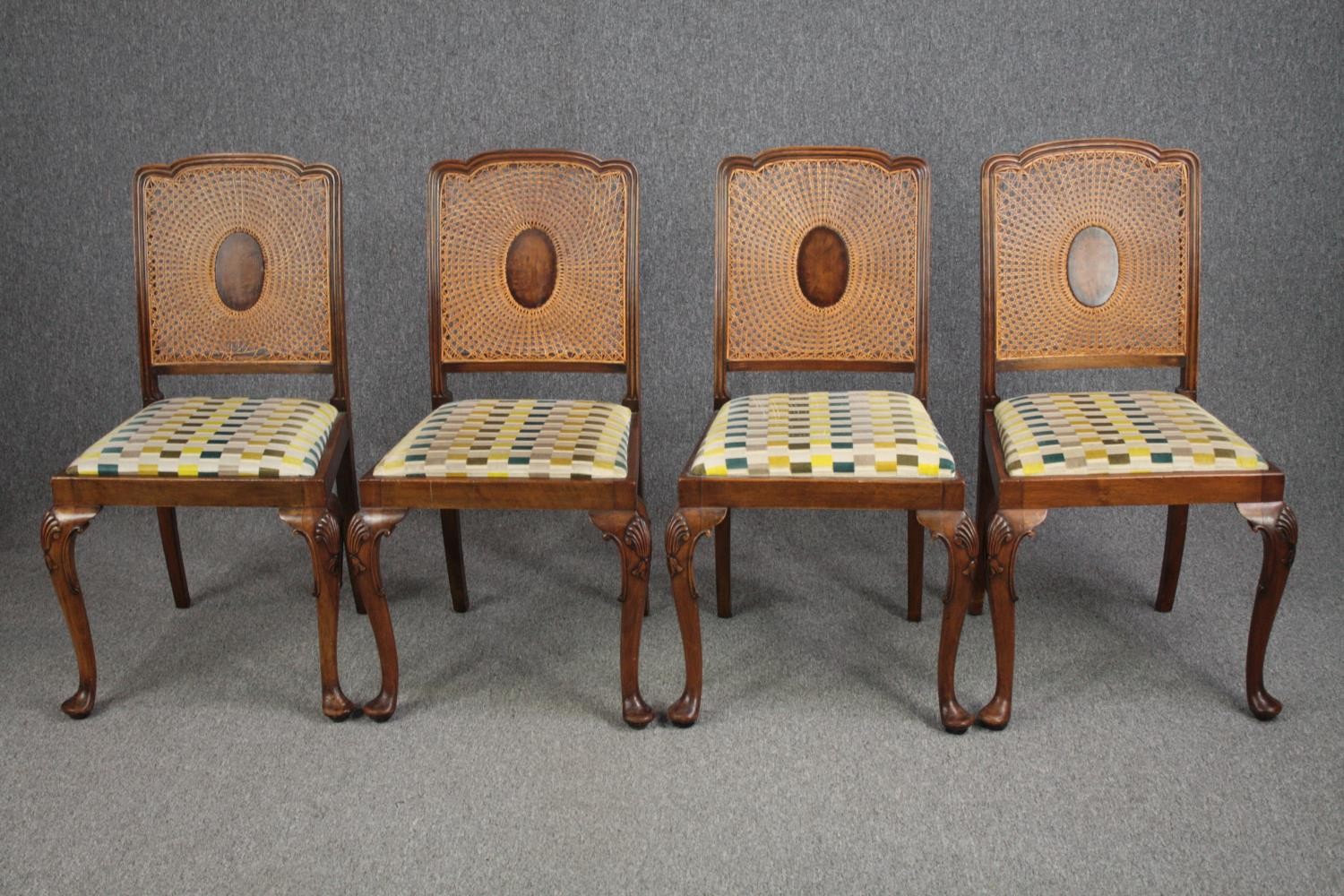 Dining chairs, a set of four Georgian style walnut with reupholstered drop in seats.