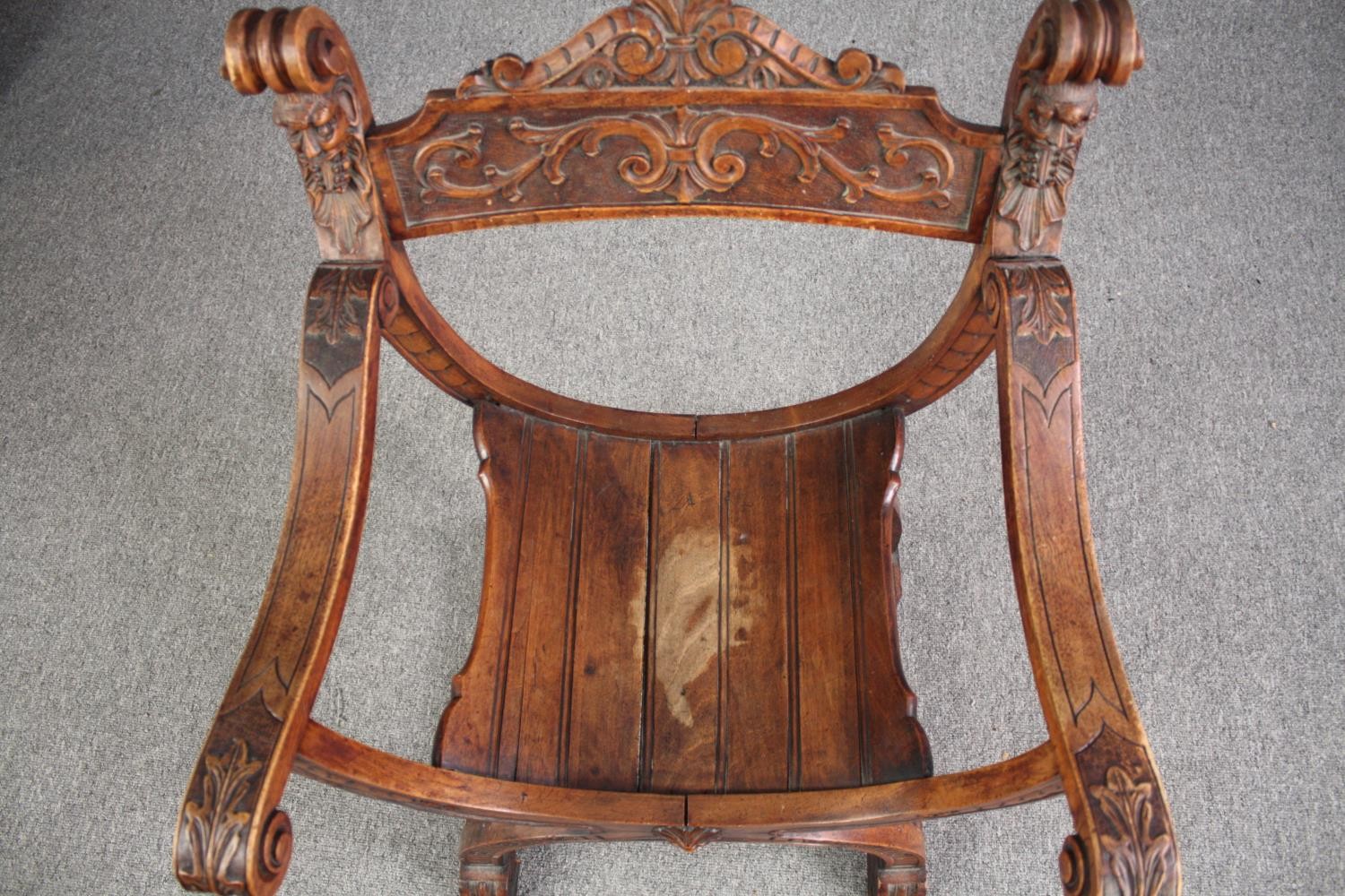 A 19th century carved walnut Savonarola chair. H.85 W.62cm. - Image 5 of 6