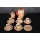 Noritake coffee set made up of five cups and saucers, a creamer, coffee pot and lone saucer. One cup