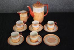 Noritake coffee set made up of five cups and saucers, a creamer, coffee pot and lone saucer. One cup