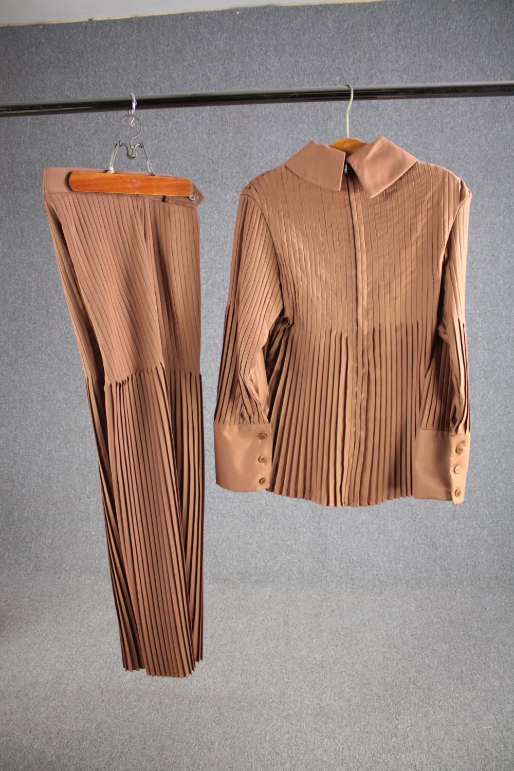 A vintage bespoke made mushroom pleated silk suit with flared bottoms.