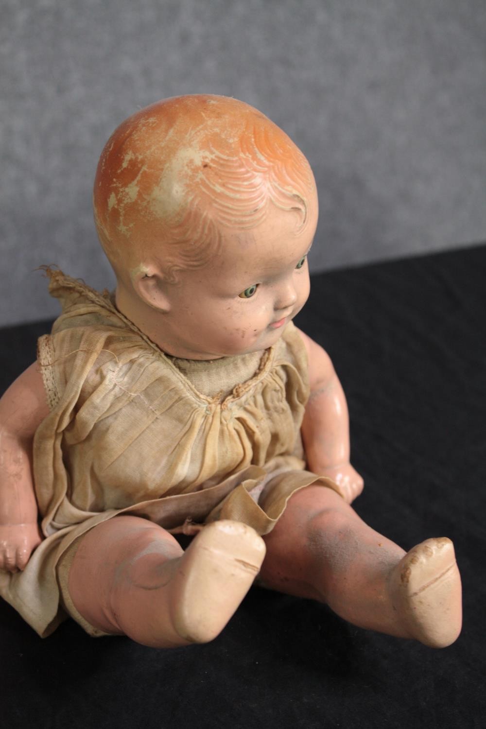 A collection of three dolls. With glass eyes. Two incomplete and missing arms. L.37cm. (largest) - Image 3 of 13
