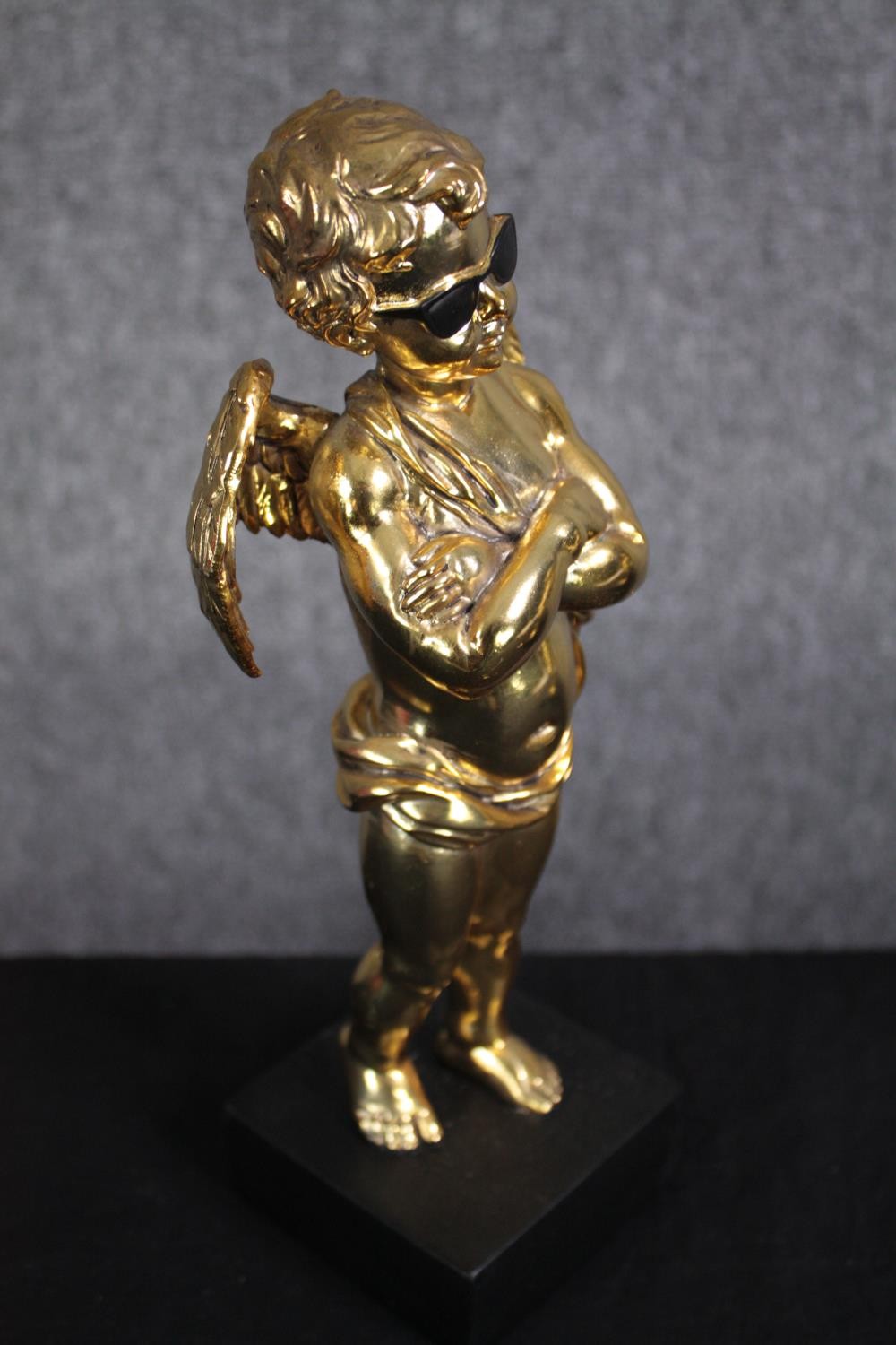 Three matching cherub figures wearing sunglasses and finished in gold. H.28cm.(each) - Image 4 of 5