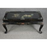 A Chinese style coffee table with carved soapstone floral decoration and inlaid mother of pearl