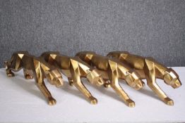 Four decorative wild cats. Moulded and finished in gold. H.14 W.47cm. (each)