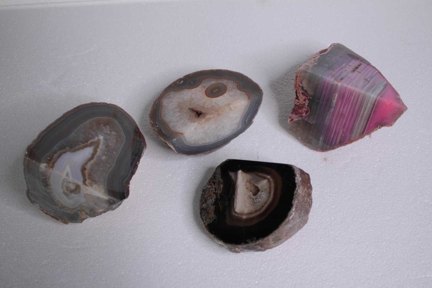 A collection of four Agate geode slices and pieces, some dyed. H.14 W.10cm. (largest)