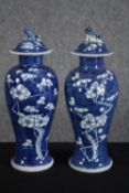 A pair of hand painted Chinese vases. Signed on the base with the makers seal. H.28cm. (each)