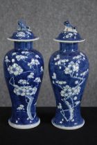 A pair of hand painted Chinese vases. Signed on the base with the makers seal. H.28cm. (each)