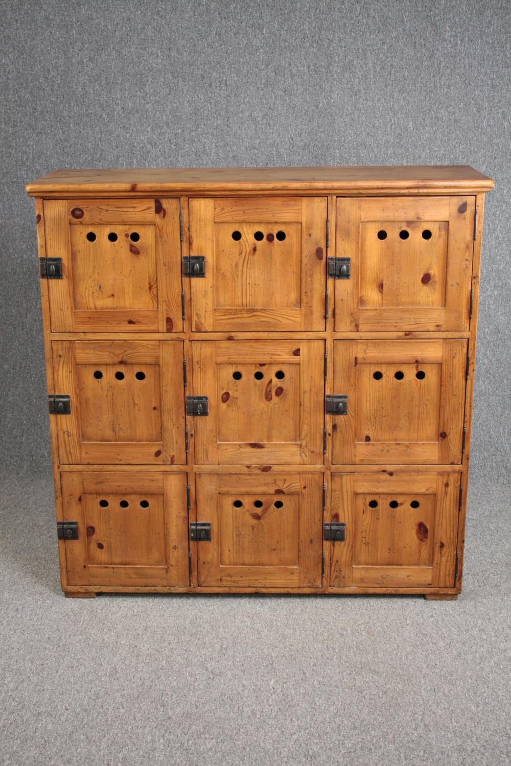 Locker cabinet, early 20th century pine with nine compartments. H.117 W.116 D.38cm.