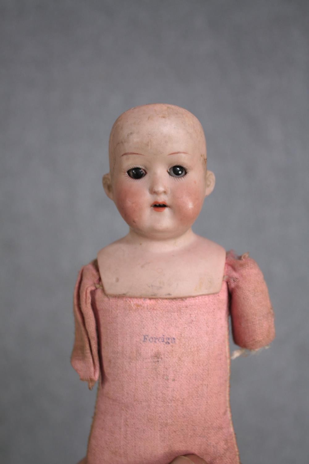 A collection of three dolls. With glass eyes. Two incomplete and missing arms. L.37cm. (largest) - Image 9 of 13