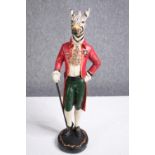 A Zebra in Victorian dress and holding a walking cane. H.47cm.