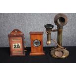 An old brass telephone, a hand wound paper calendar and, a wooden cased pocket watch. H.30cm. (