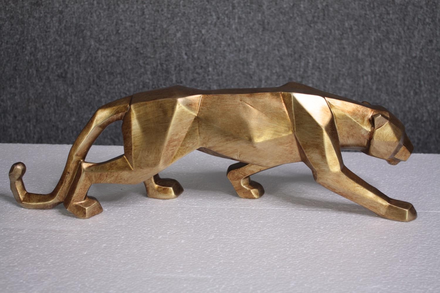 Four decorative wild cats. Moulded and finished in gold. H.14 W.47cm. (each) - Image 2 of 4