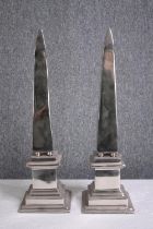 Two chromed obelisks. H.53cm. (each)