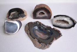 A collection of four Agate geodes and geode slices along with a carved agate ashtray. H.27 W.