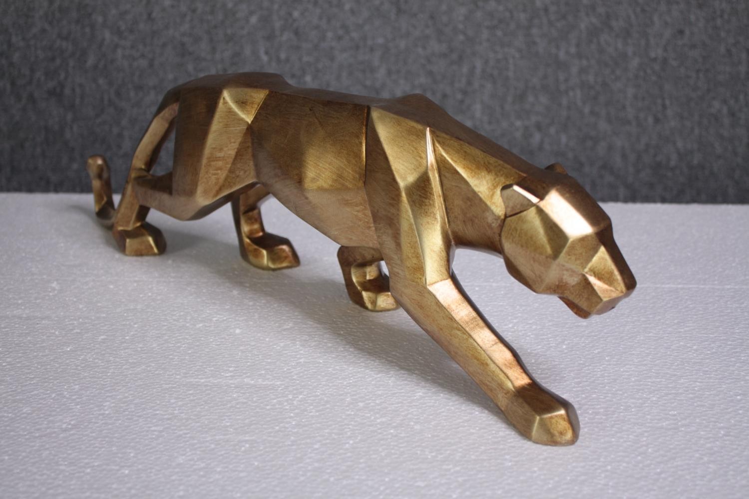 Four decorative wild cats. Moulded and finished in gold. H.14 W.47cm. (each) - Image 3 of 4