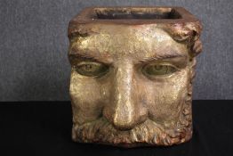 A planter in the form of a classical mask finished in gold. H.36 W.36 D.45cm.