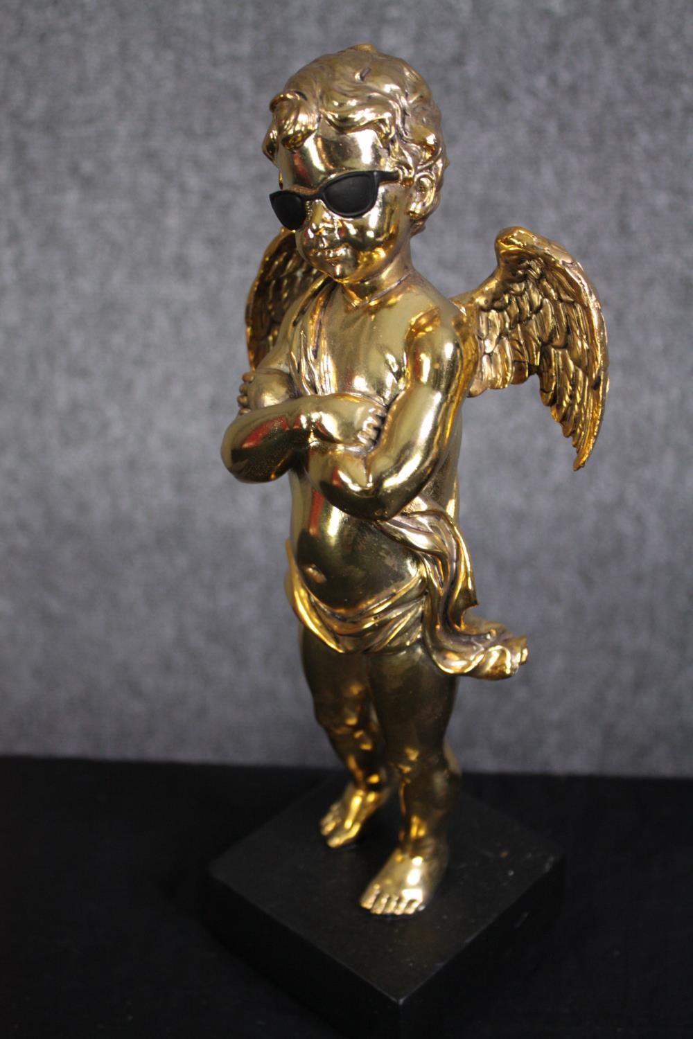 Three matching cherub figures wearing sunglasses and finished in gold. H.28cm.(each) - Image 3 of 5