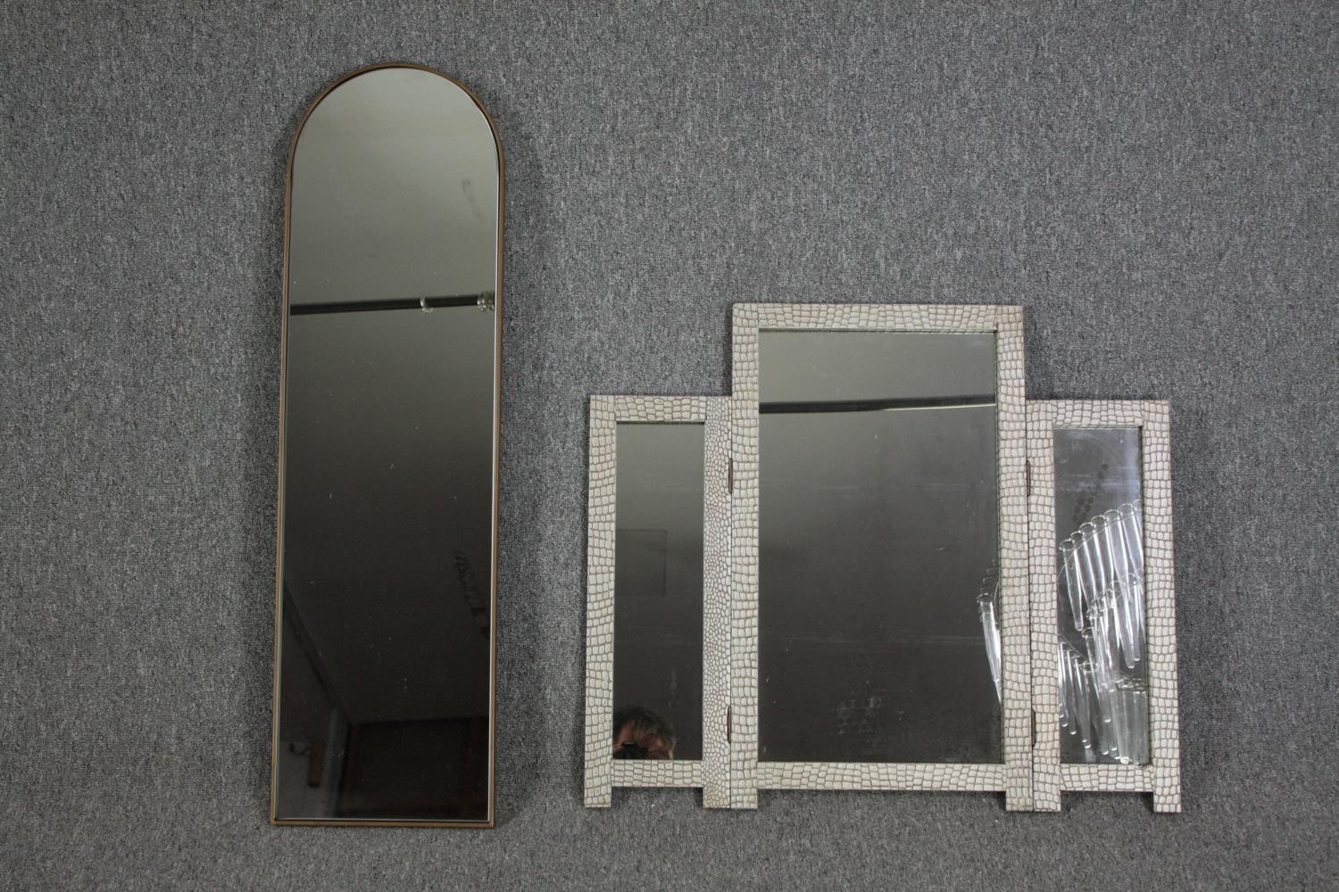 A triptych mirror and a contemporary arched mirror. H.100 W.29cm. (largest)