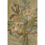 A framed embroidery. Flowers. Early twentieth century. Framed and glazed. H.42 W.35cm.