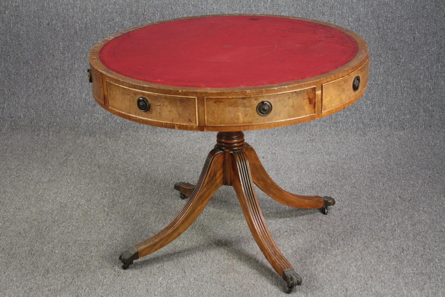 A Georgian style mahogany library drum table. H.72 Dia.92cm.