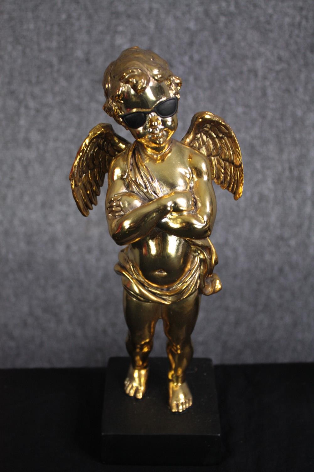 Three matching cherub figures wearing sunglasses and finished in gold. H.28cm.(each) - Image 2 of 5