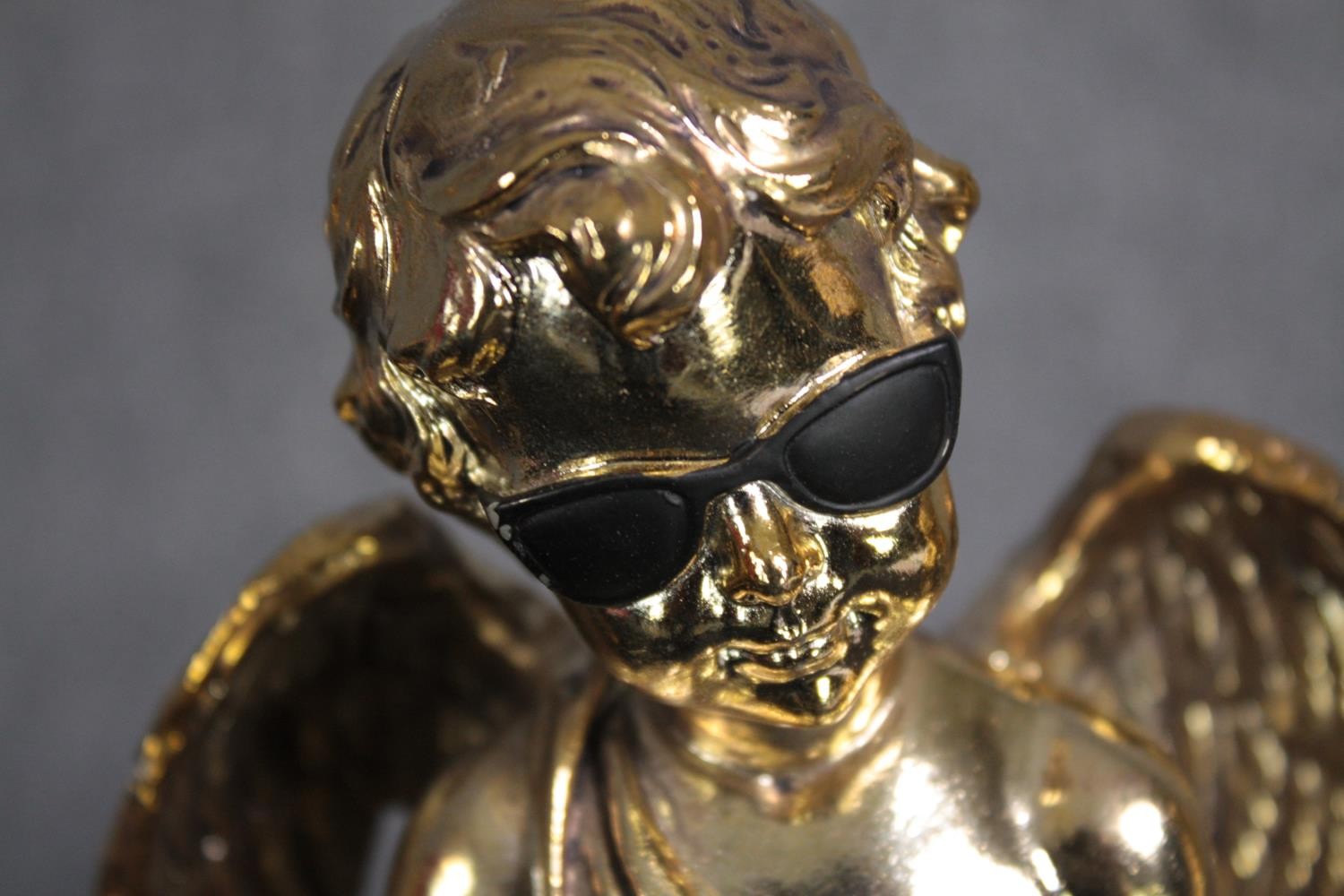 Three matching cherub figures wearing sunglasses and finished in gold. H.28cm.(each) - Image 5 of 5