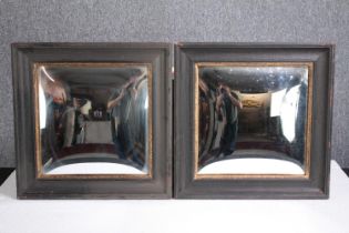A pair of contemporary painted and gilt framed convex mirrors. H.40 W.40cm. (each)