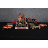 A collection of retro tin wind up toys including a musical train. A couple in need of restoration.