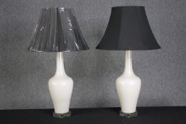 A pair of porcelain lamps with matching shades. H.80cm. (each)