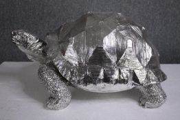 A large tortoise. Moulded silvered finish. H.31 L.60 D.41cm.